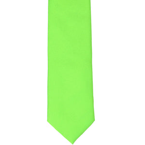 A hot lime green solid tie, laid out flat