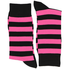 Load image into Gallery viewer, Black and pink striped socks, folded in half, on a white background