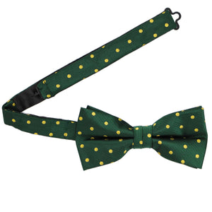 A hunter green and gold pre-tied bow tie with the band collar open