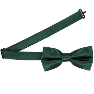 A pre-tied hunter green bow tie with the band collar open