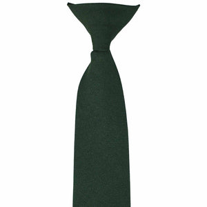 The front knot on a hunter green clip-on uniform tie
