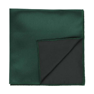A hunter green solid color pocket square with the corner flipped up to show the backside