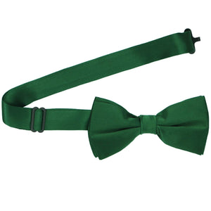 A pre-tied hunter green bow tie with the band open