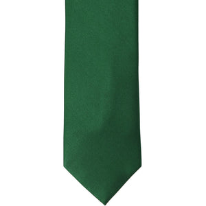 The front of a hunter green silk tie, laid out flat