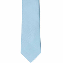Load image into Gallery viewer, The front of an ice blue tone-on-tone herringbone slim tie, laid out flat