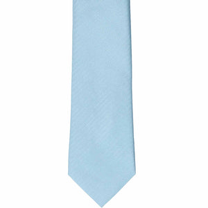 The front of an ice blue tone-on-tone herringbone slim tie, laid out flat