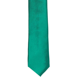 The front of a jade skinny tie, laid flat