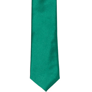 The front of a jade slim tie, laid out flat