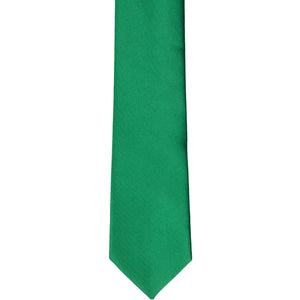The front of a kelly green skinny tie, laid flat