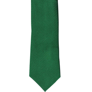The front of a kelly green tone-on-tone slim tie, laid out flat