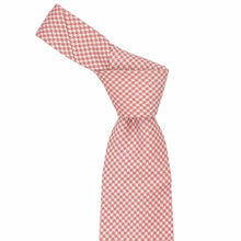 Load image into Gallery viewer, Red and white houndstooth patterned tie, knotted, on a white background