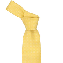 Load image into Gallery viewer, Yellow tie, knotted, with a subtle dot pattern on a white background