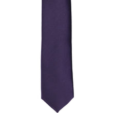 Load image into Gallery viewer, The front of a lapis purple skinny tie, laid flat