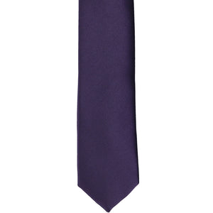 The front of a lapis purple skinny tie, laid flat