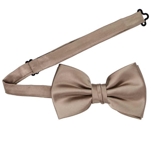 A latte pre-tied bow tie with the band collar open