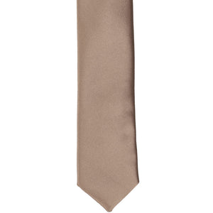 The front of a latte skinny tie, laid flat