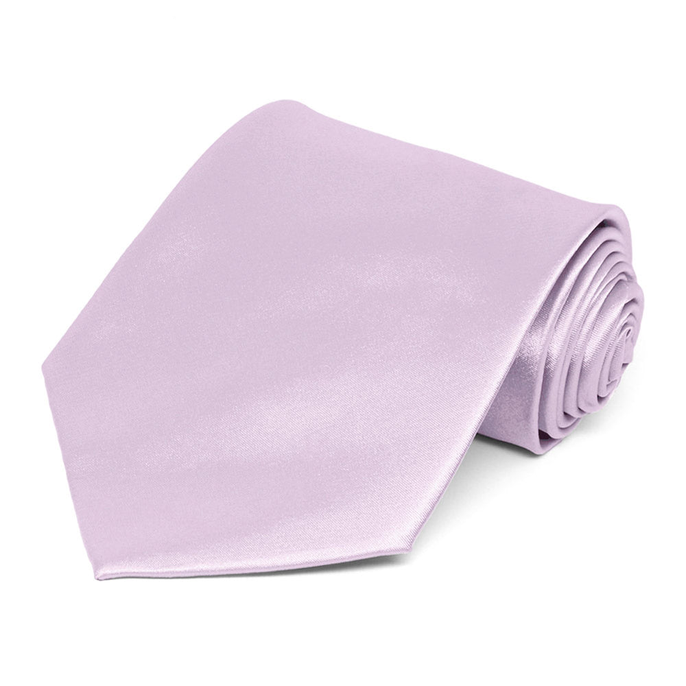 A lavender frost pastel solid tie, rolled to show off the front and color