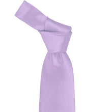 Load image into Gallery viewer, Close-up of a solid lavender necktie knot, highlighting the soft purple tone and subtle ribbed texture of the fabric.