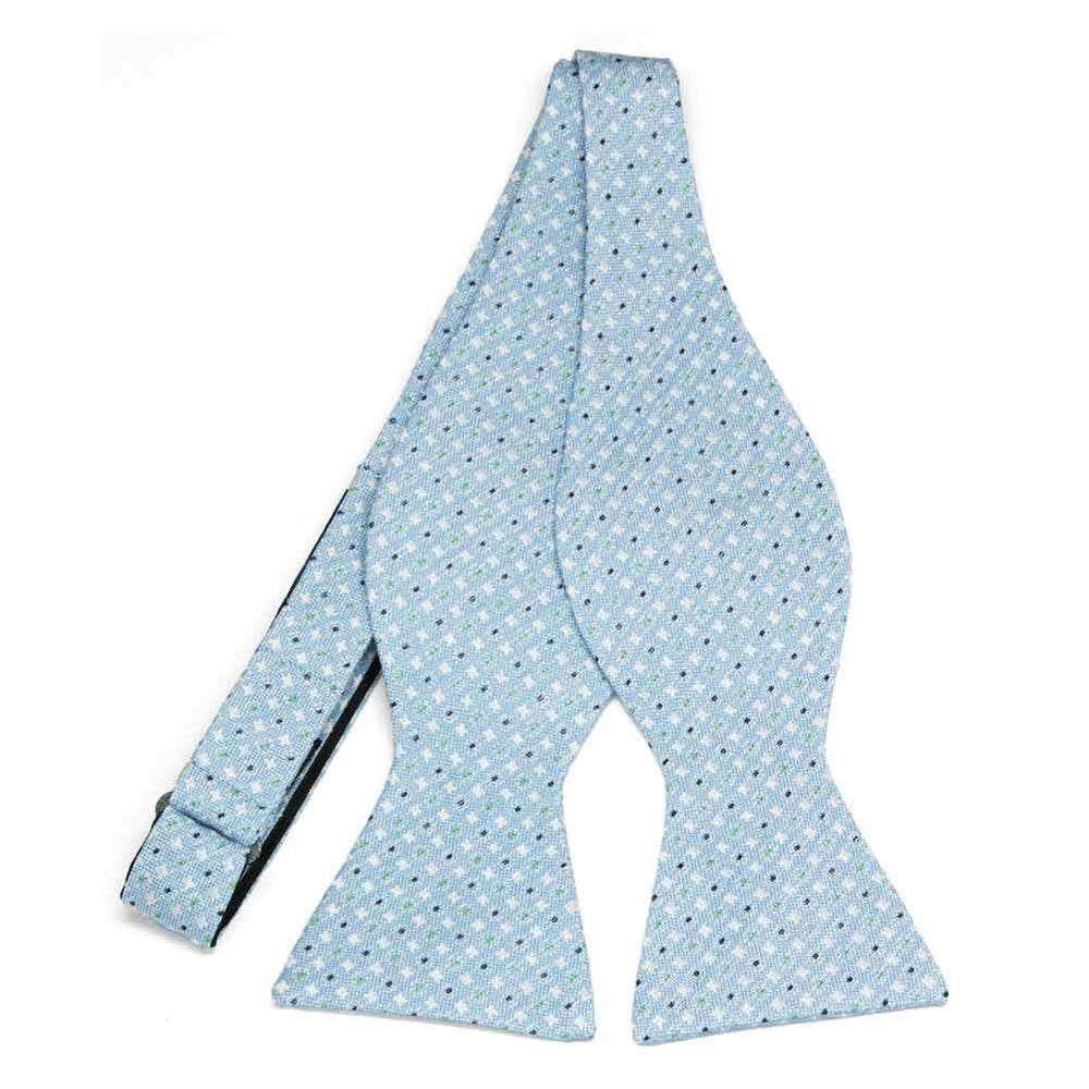 An untied light blue self-tie bow tie with a small white and dark blue check pattern