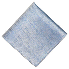 Load image into Gallery viewer, A folded light blue pocket square with a subtle textured weave, displayed diagonally on a solid white background.