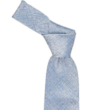 Load image into Gallery viewer, A light blue and white textured tie with a subtle crosshatch pattern, shown tied in a knot on a solid white background.