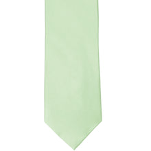 Load image into Gallery viewer, The front of a light mint silk tie, laid out flat