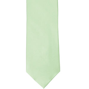 The front of a light mint silk tie, laid out flat