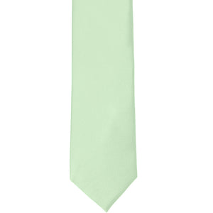 The front of a light mint silk tie, laid out flat