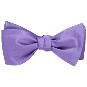 A light purple self-tie bow tie, tied