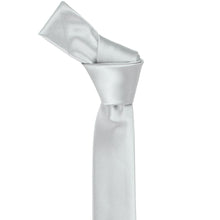 Load image into Gallery viewer, A light silver skinny tie with a knot tied at the top