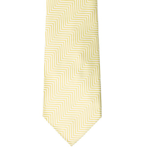 The front of a light yellow and white chevron striped tie, laid out flat