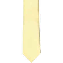 Load image into Gallery viewer, The front of a light yellow skinny tie, laid flat