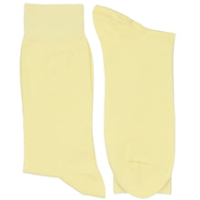 Load image into Gallery viewer, A pair of light yellow crew socks shown flat against a plain white background.