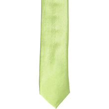 Load image into Gallery viewer, The front of a lime green skinny tie, laid flat