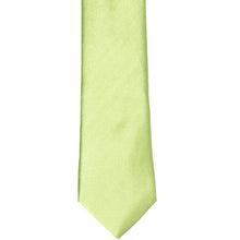 Load image into Gallery viewer, The front of a lime green slim tie, laid out flat