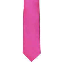 Load image into Gallery viewer, The front of a magenta skinny tie, laid flat