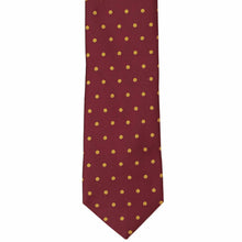 Load image into Gallery viewer, The front of a maroon and gold polka dot necktie