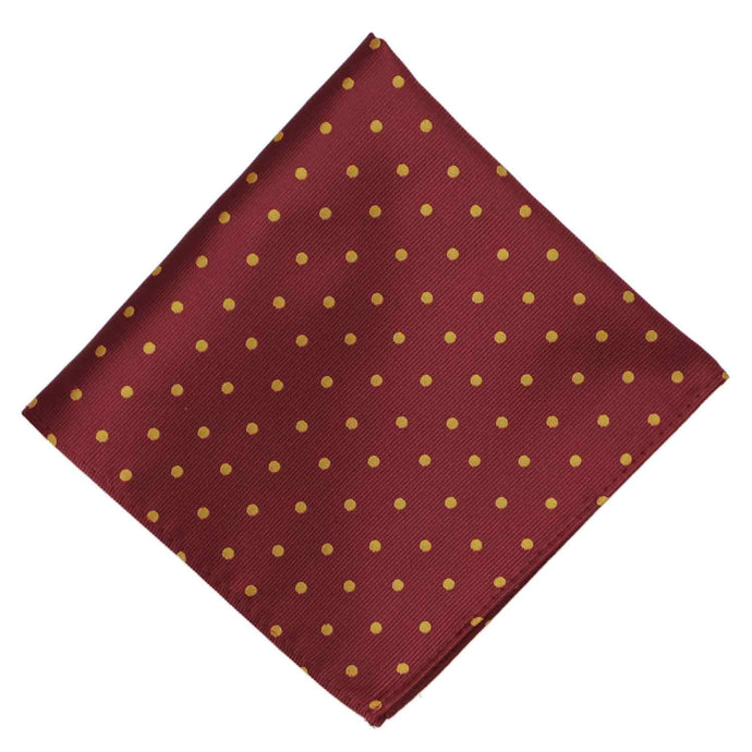 A maroon and gold polka dot pocket square