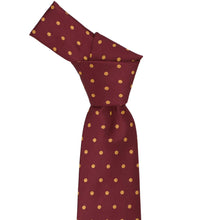 Load image into Gallery viewer, Knotted maroon tie with gold polka dots on a white background