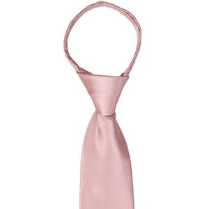 The knot and collar on a mauve zipper tie