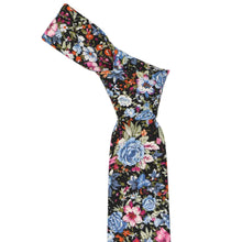 Load image into Gallery viewer, A dusty blue and black floral tie with a knot