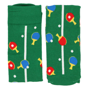 A pair of green ping pong socks, folded down the middle