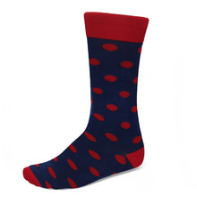 Load image into Gallery viewer, A single crew sock with a navy blue body covered in red polka dots, featuring a solid red cuff, toe, and heel, shown on a plain white background.