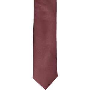 The front of a merlot skinny tie, laid flat