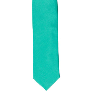 The front of a mermaid skinny tie, laid flat