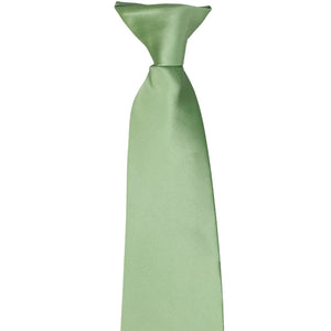 The knot on a mint green clip-on tie