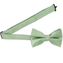 Load image into Gallery viewer, A mint green pre-tied bow tie with the band collar open