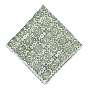 A mint green abstract pattern pocket square, folded into a diamond shape