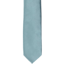Load image into Gallery viewer, The front of a mystic blue skinny tie, laid flat