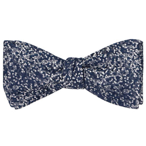 A navy blue and silver pebbled pattern bow tie